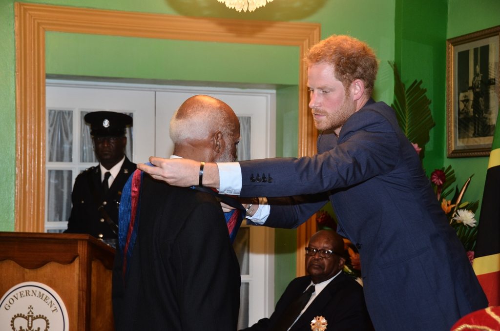 FORMER GOVERNOR GENERAL SIR EDMUND LAWRENCE FORMALLY RECEIVES KNIGHTHOOD FROM PRINCE HARRY